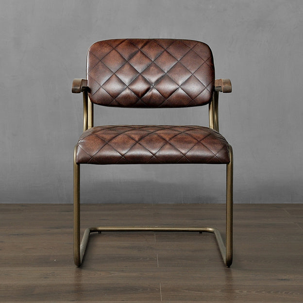 LoftHome genuine leather chair, crafted with a quilted seat design and vintage brass frame, adding timeless sophistication to any space.