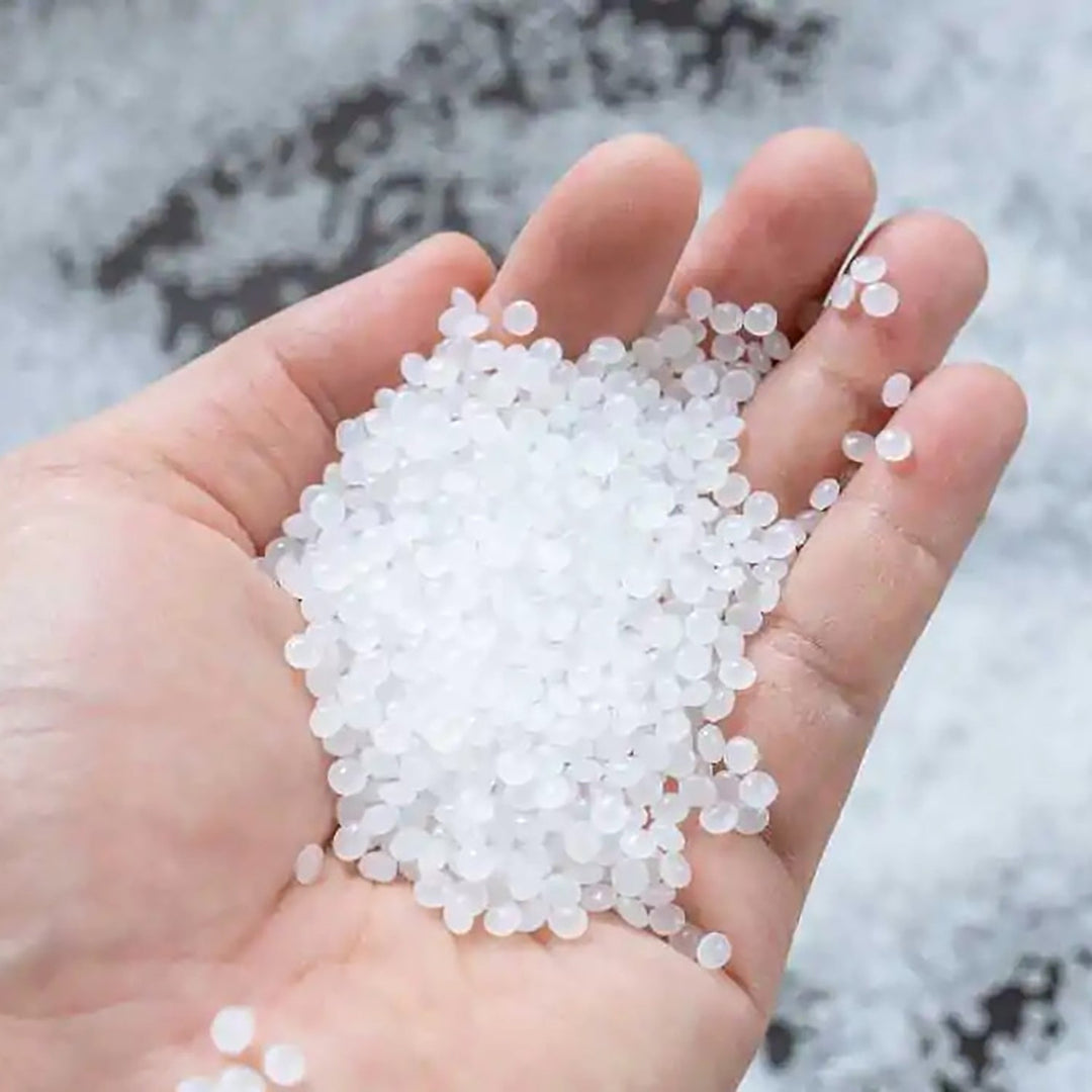 Resin furniture material with refined polymer texture and clean finish, offering durability and a sleek modern aesthetic for interiors by Loft Home.