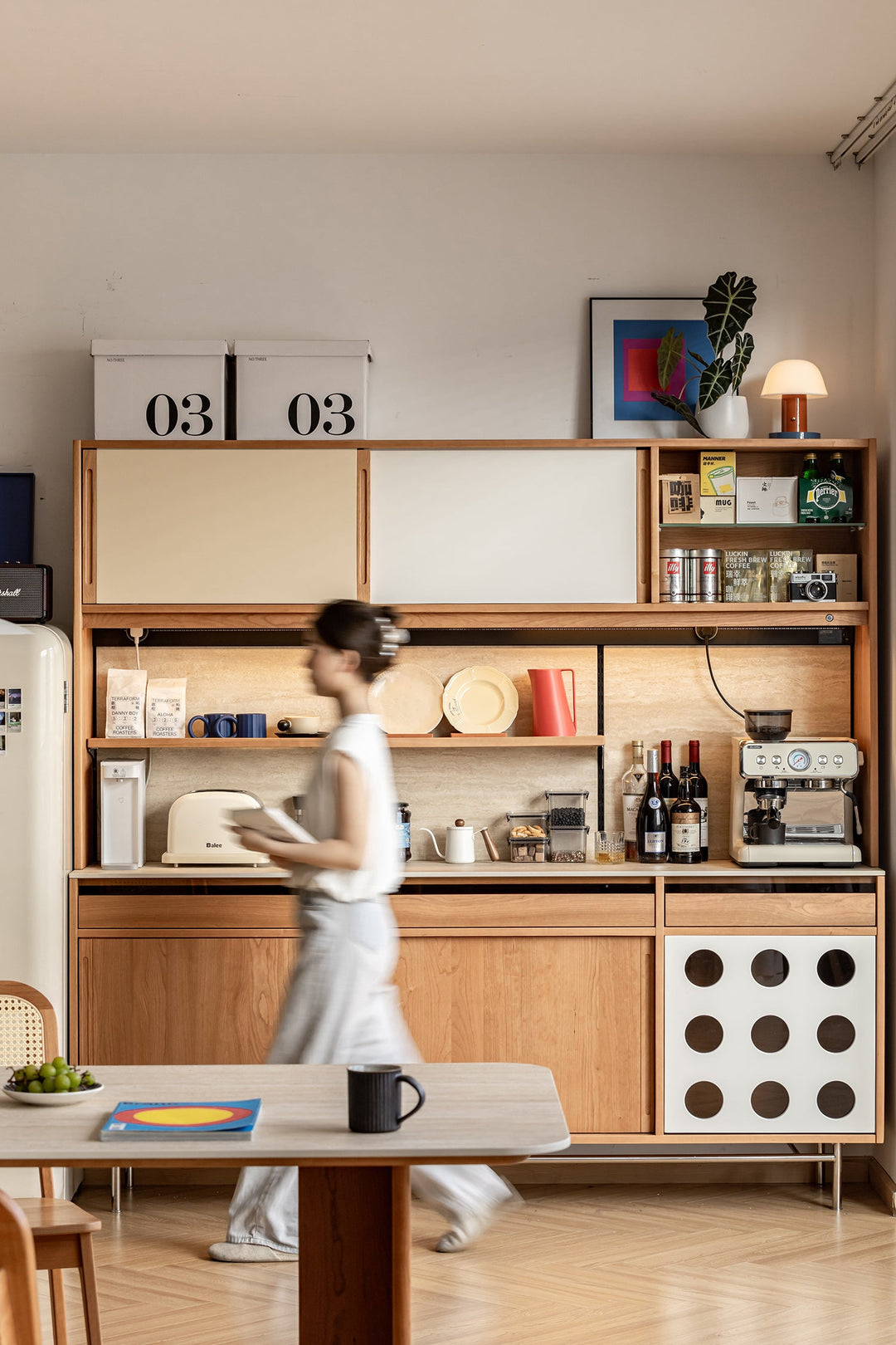 Scandinavian-style wooden kitchen cabinet with sliding doors and open shelving, featuring stylish storage for appliances, wine, and tableware, perfect for modern homes.