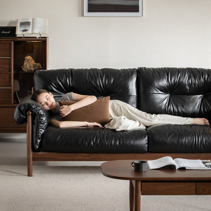 Scandinavian chenille velvet fabric walnut wood 3 seater sofa sofa open backed in panoramic view.