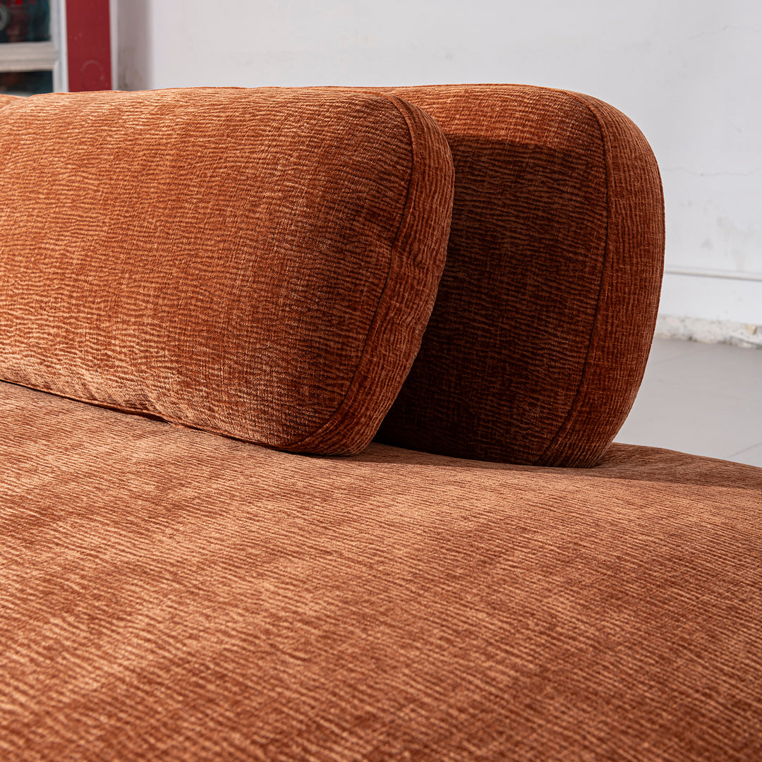 Cream velvet fabric modular chaise 2 seater sofa bubba in panoramic view.