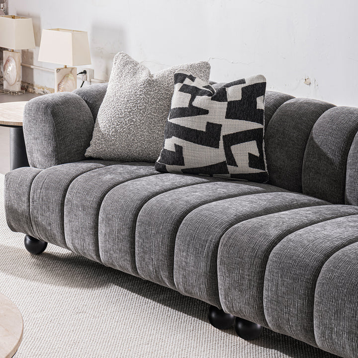 Modern velvet fabric sectional 4 seater sofa raven in panoramic view.