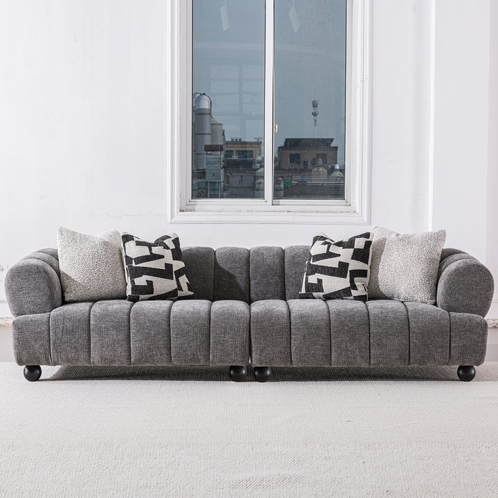 Modern velvet fabric sectional 4 seater sofa raven in still life.