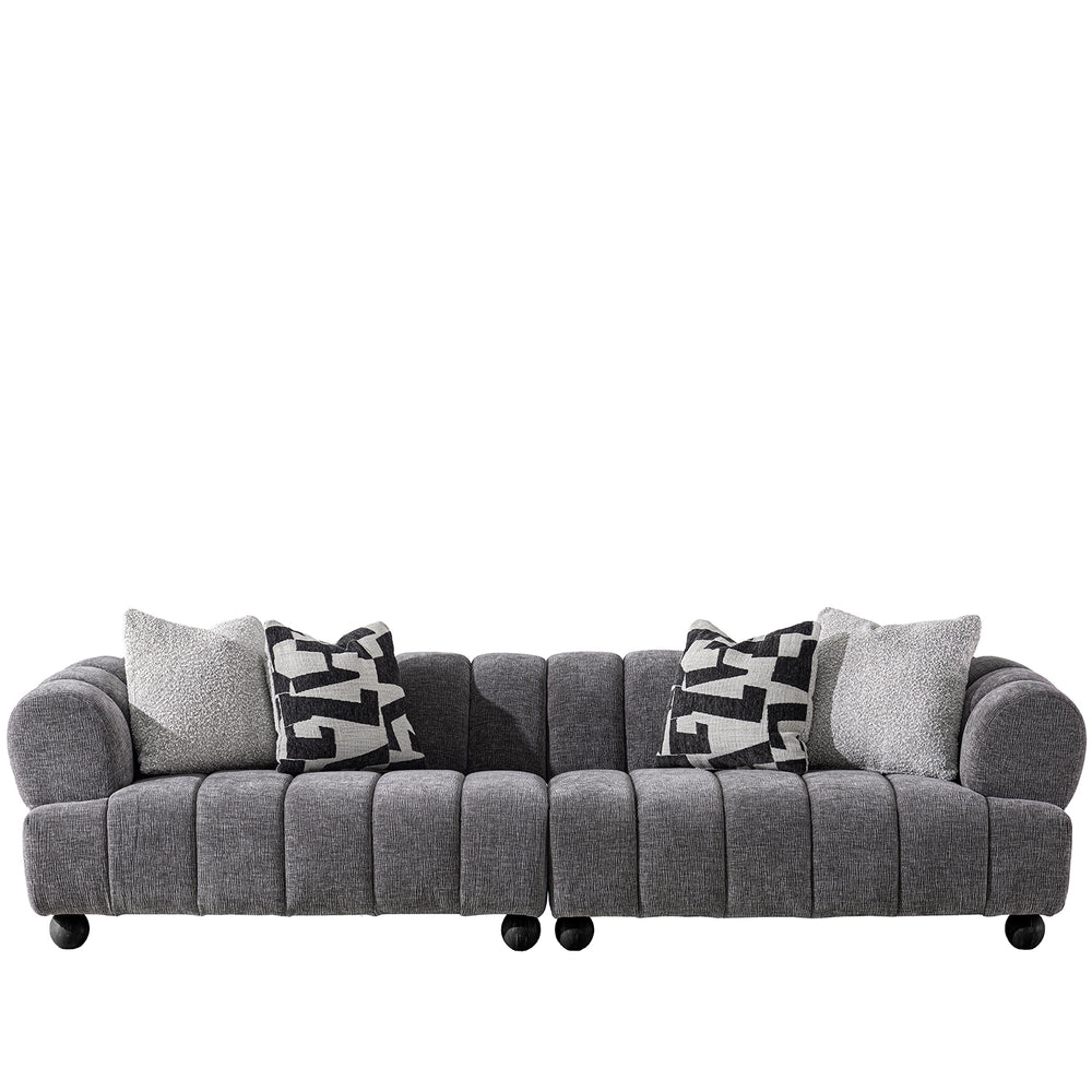 Modern velvet fabric sectional 4 seater sofa raven in white background.