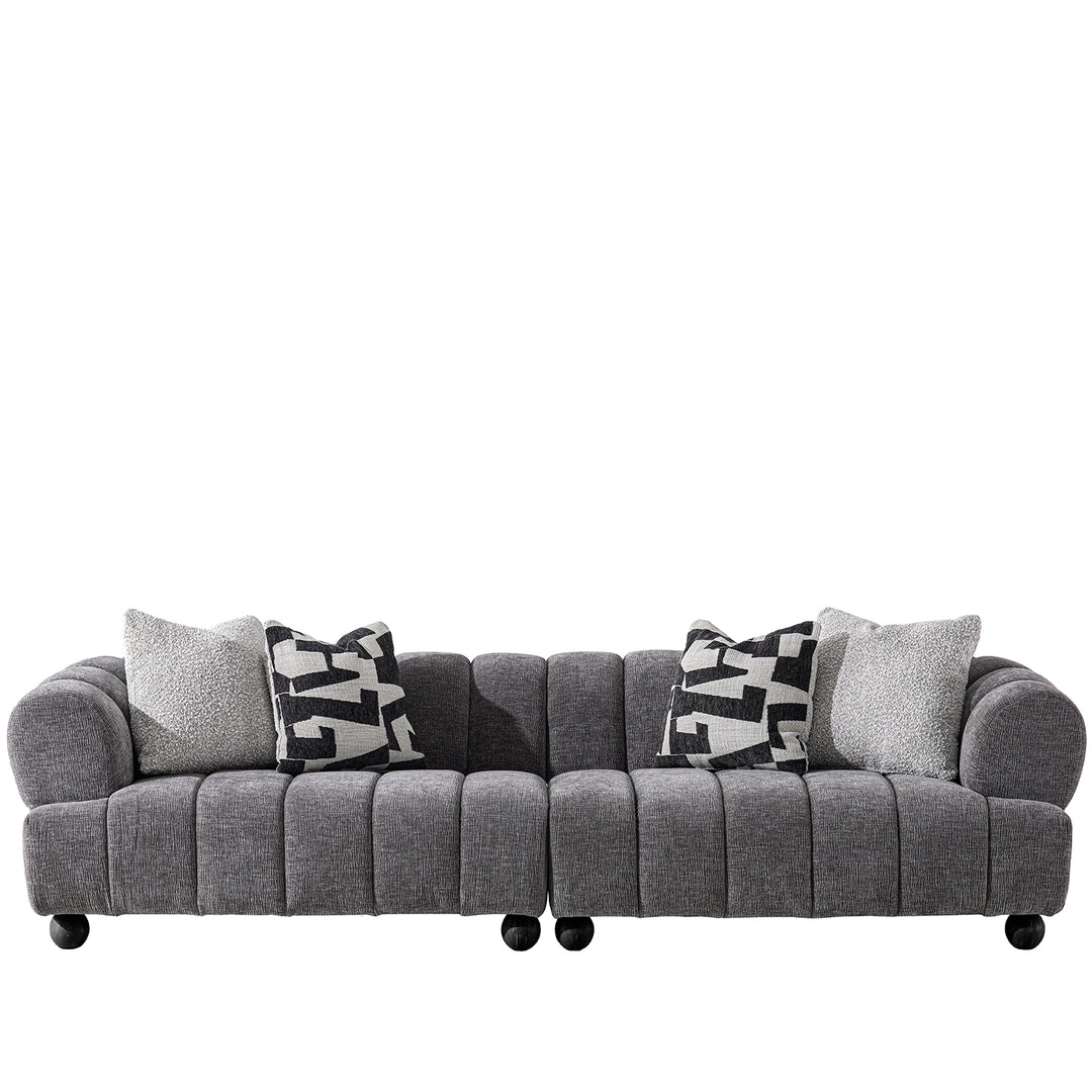 Modern velvet fabric sectional 4 seater sofa raven in white background.
