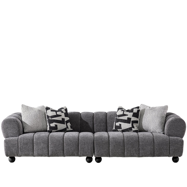 Modern velvet fabric sectional 4 seater sofa raven in white background.