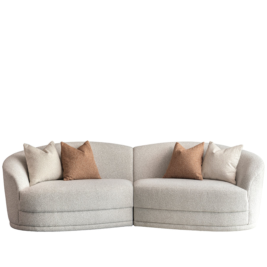 Modern boucle fabric modular sectional 4 seater sofa curva in white background.