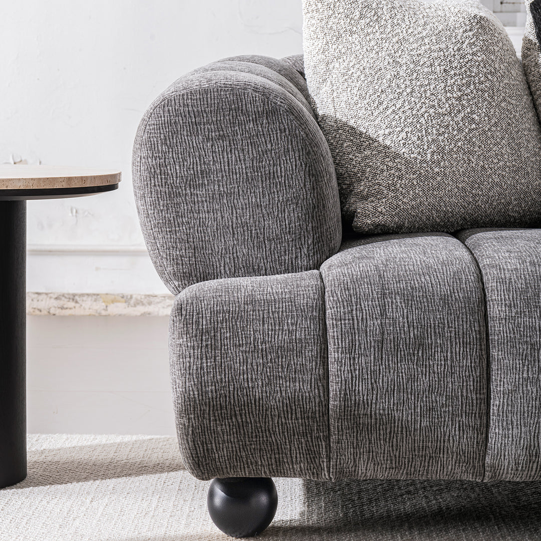 Modern velvet fabric 2 seater sofa raven with context.