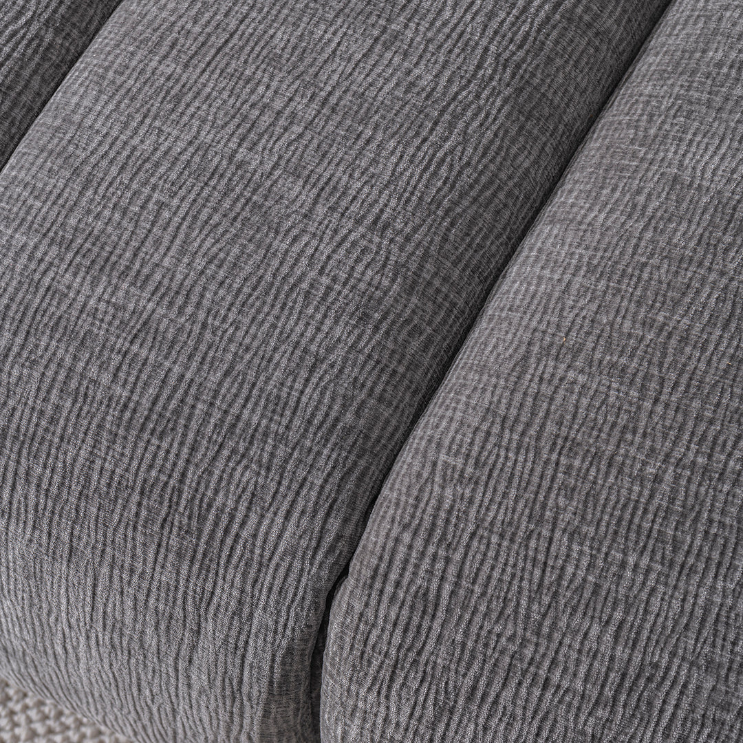 Modern velvet fabric 3 seater sofa raven in close up details.