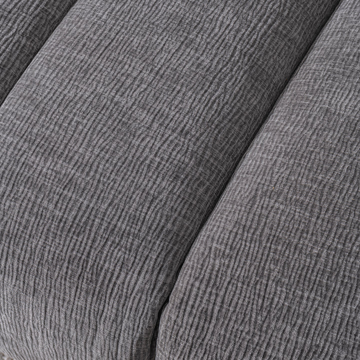 Modern velvet fabric sectional 4 seater sofa raven in close up details.