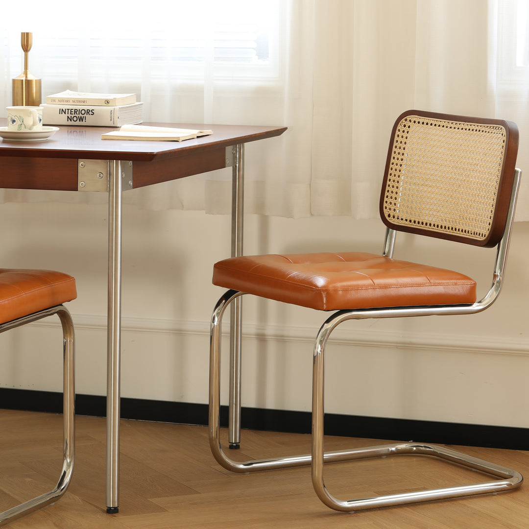 Vintage rattan pu leather dining chair hoh xil in still life.