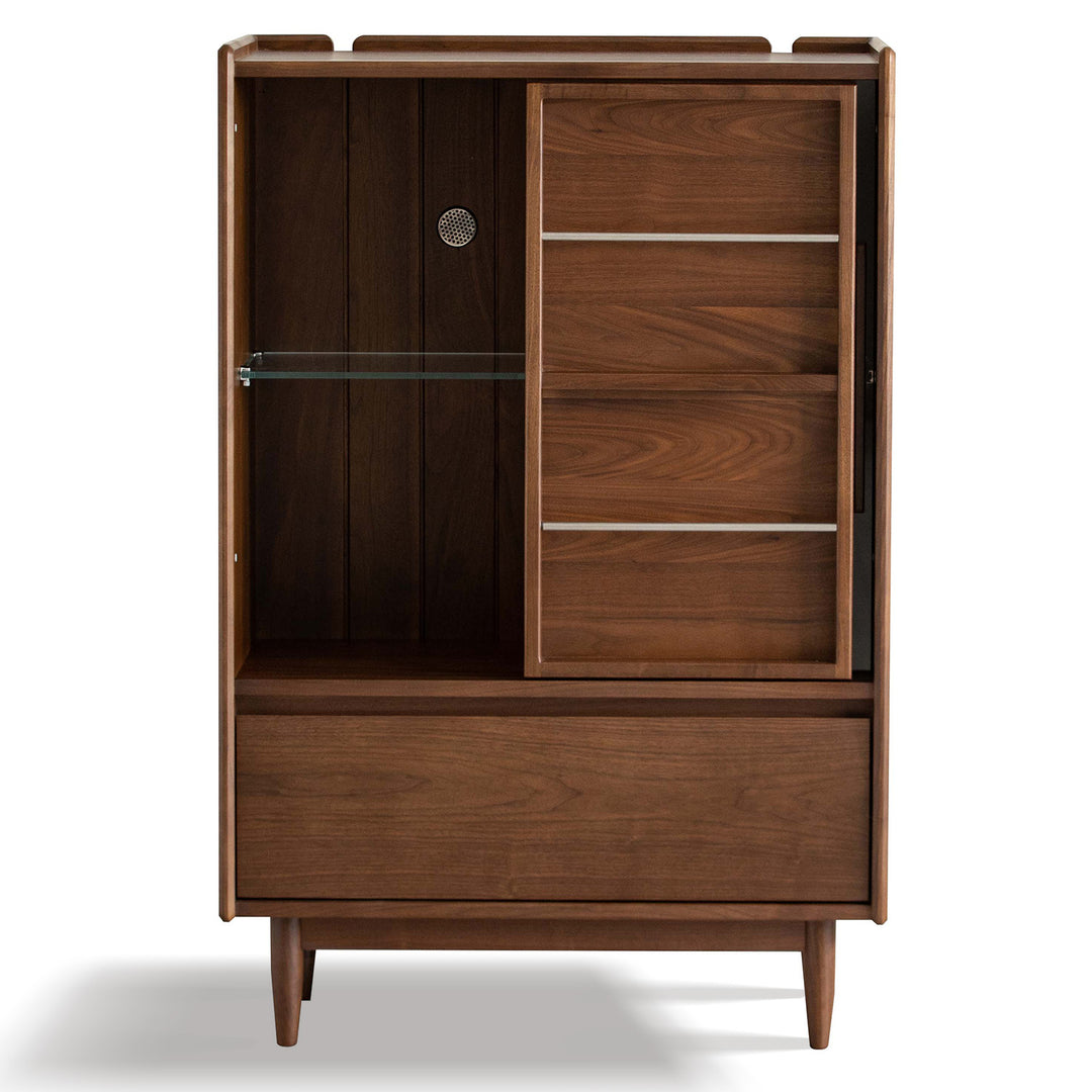 Vintage walnut wood side cabinet vista in white background.