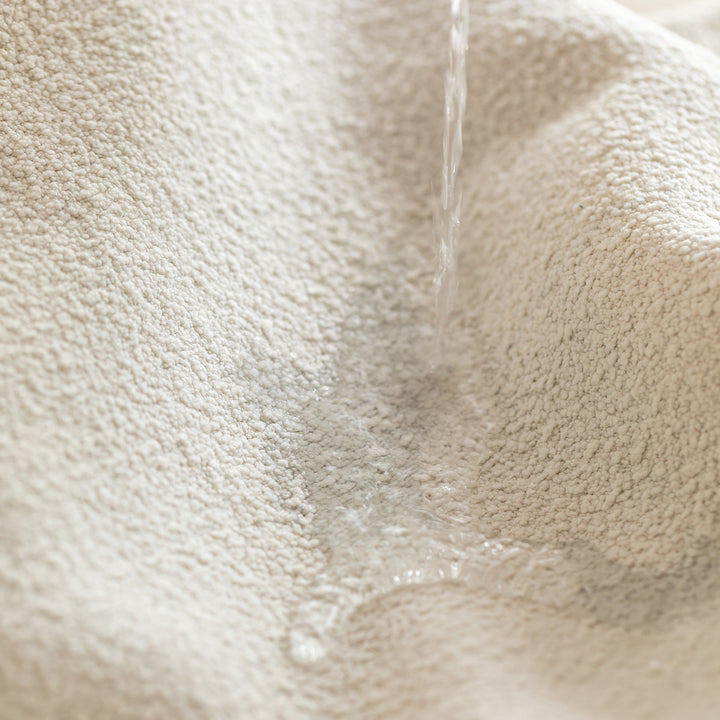 Scandinavian premium boucle fabric sofa cover with context.