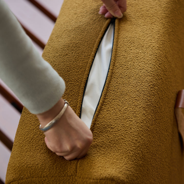 Scandinavian premium boucle fabric sofa cover in panoramic view.