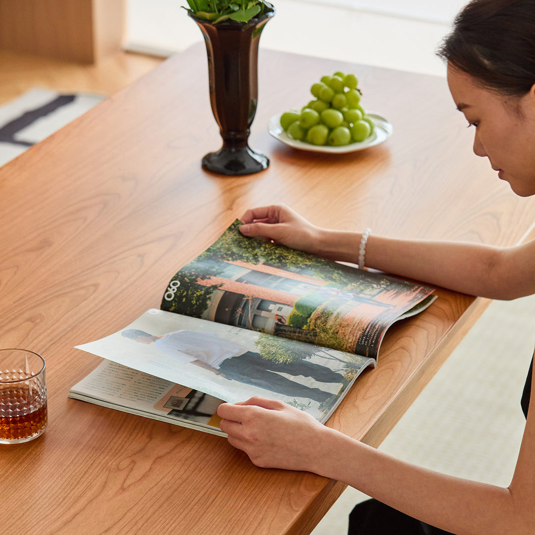 Scandinavian cherry wood dining table eclipse in real life style.