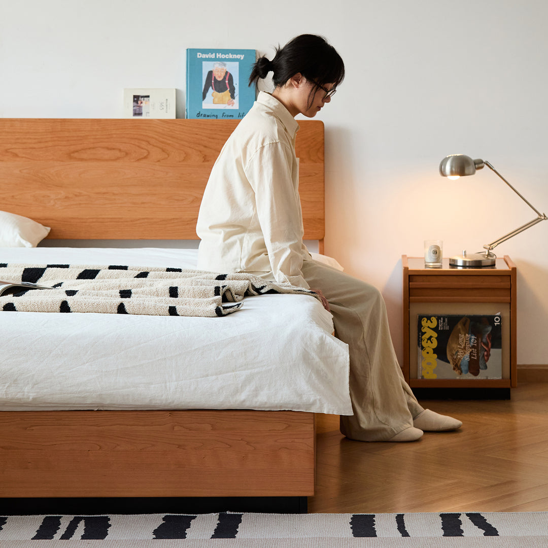 Scandinavian cherry wood storage bed toast in real life style.