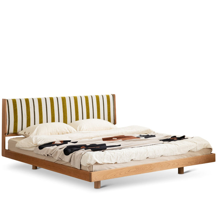 Scandinavian cherry wood bed les in white background.