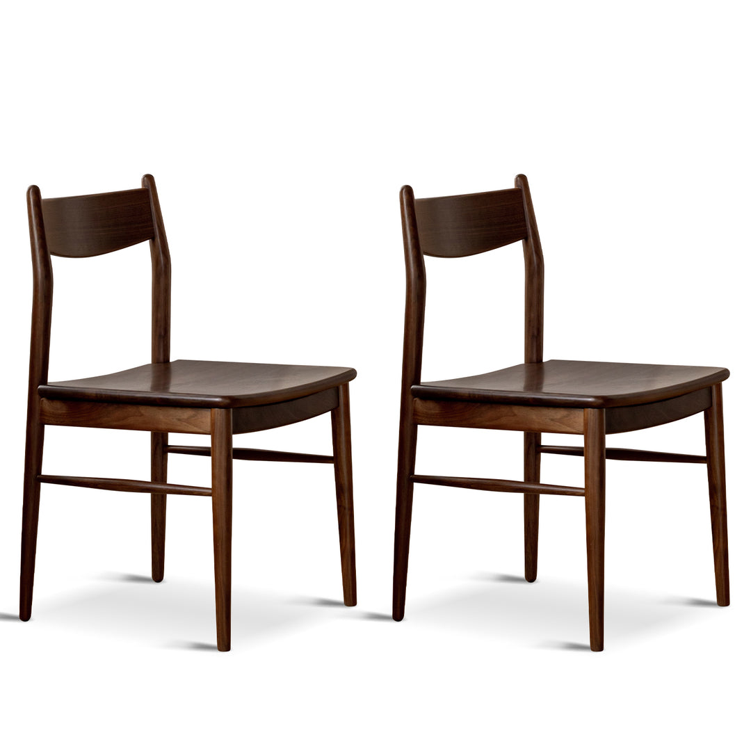 Vintage walnut wood dining chair chrono in still life.