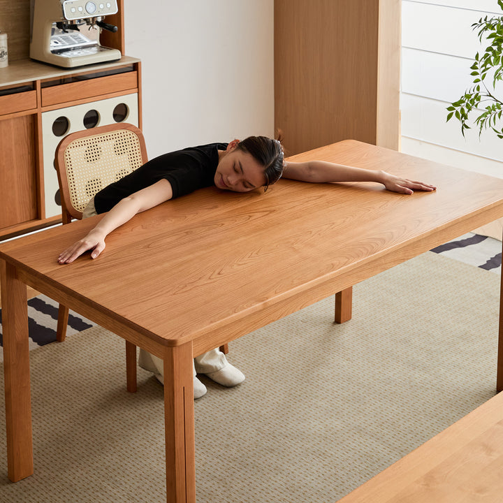 Scandinavian cherry wood dining table eclipse with context.