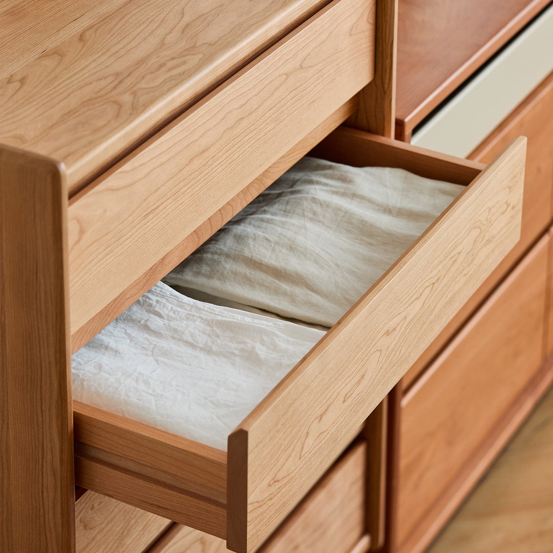 Scandinavian cherry wood chest of drawers vista in details.