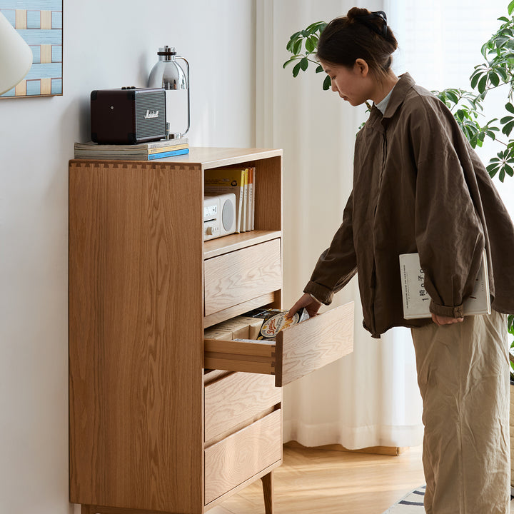 Scandinavian oak wood chest of 5 drawers floating light with context.