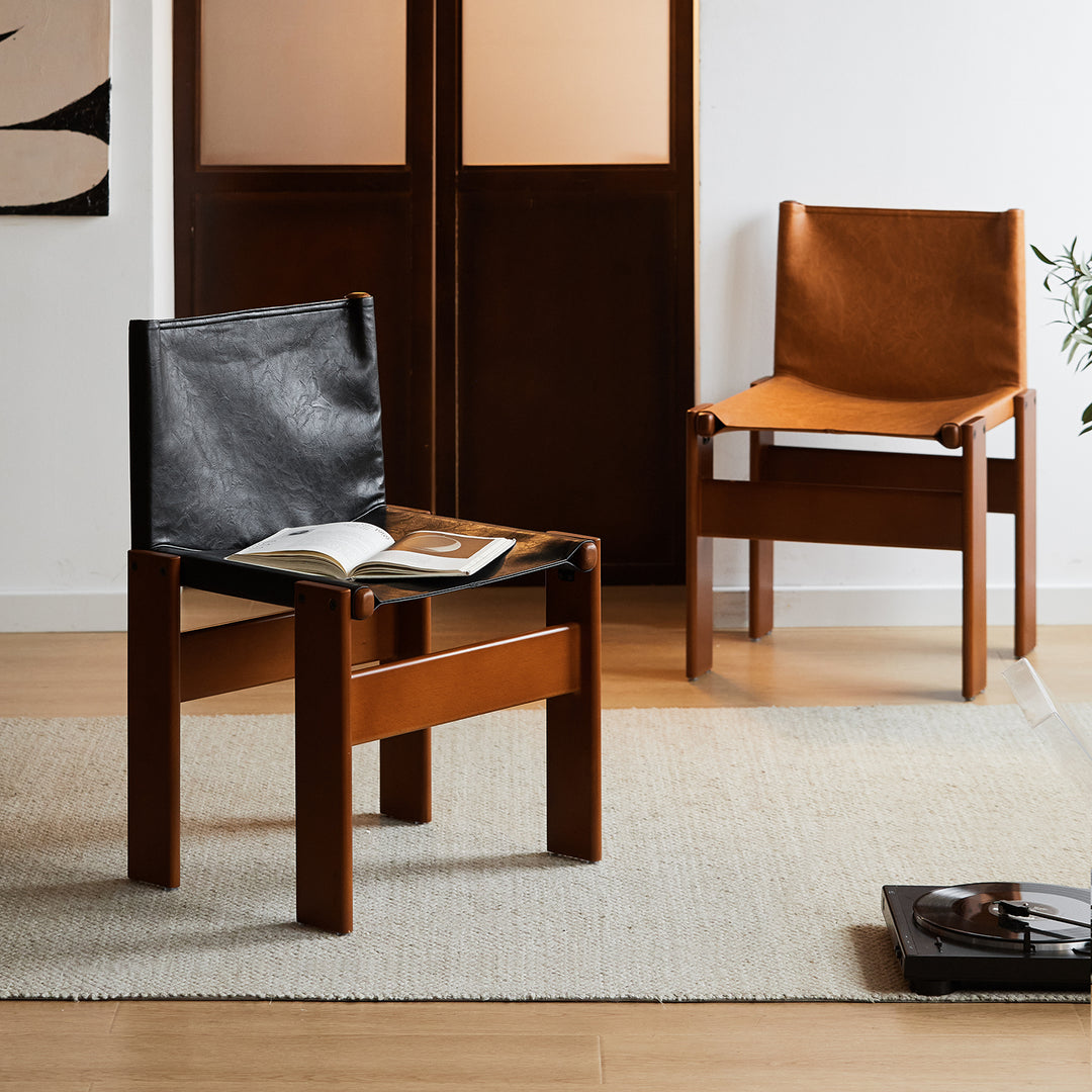 Vintage genuine leather dining chair tansu with context.