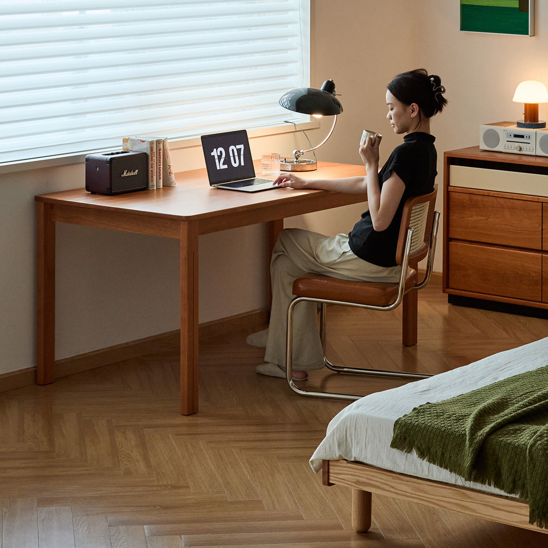 Scandinavian cherry wood dining table eclipse in panoramic view.