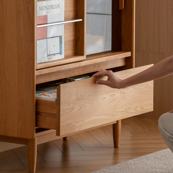 Scandinavian cherry wood side cabinet vista in still life.