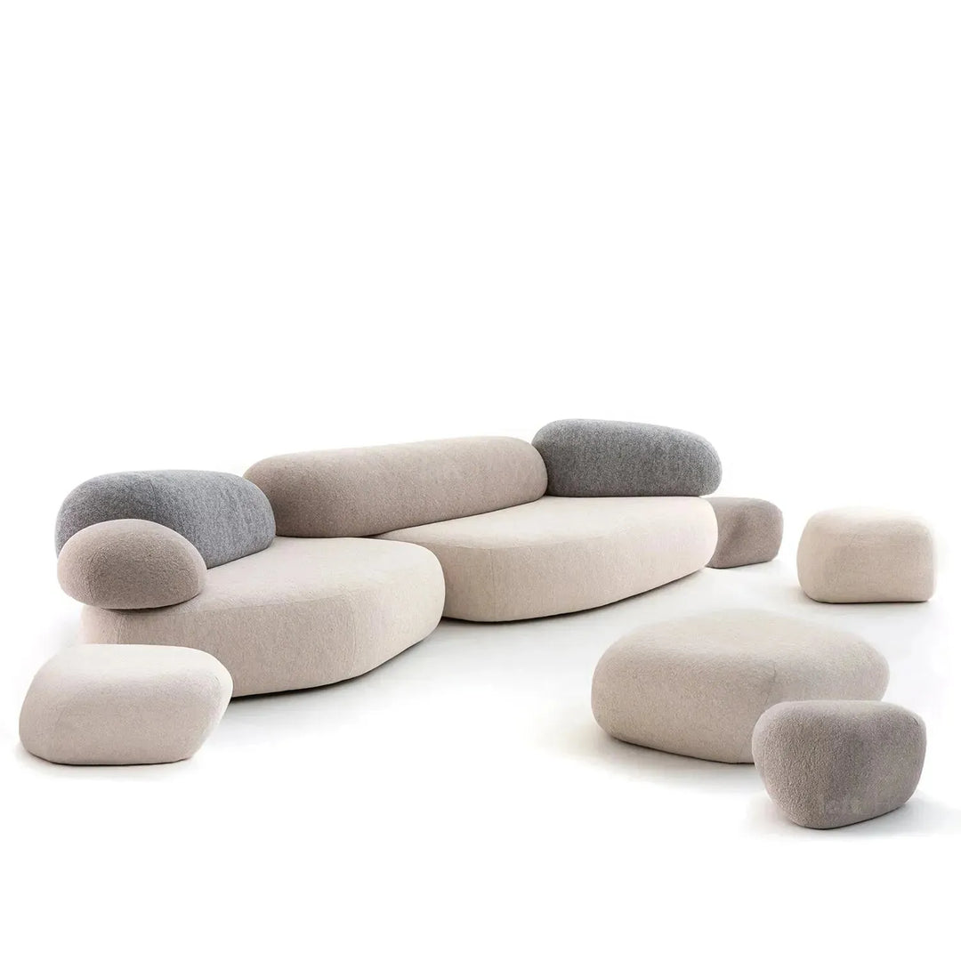 Contemporary fabric 7 seater sofa pebble in still life.