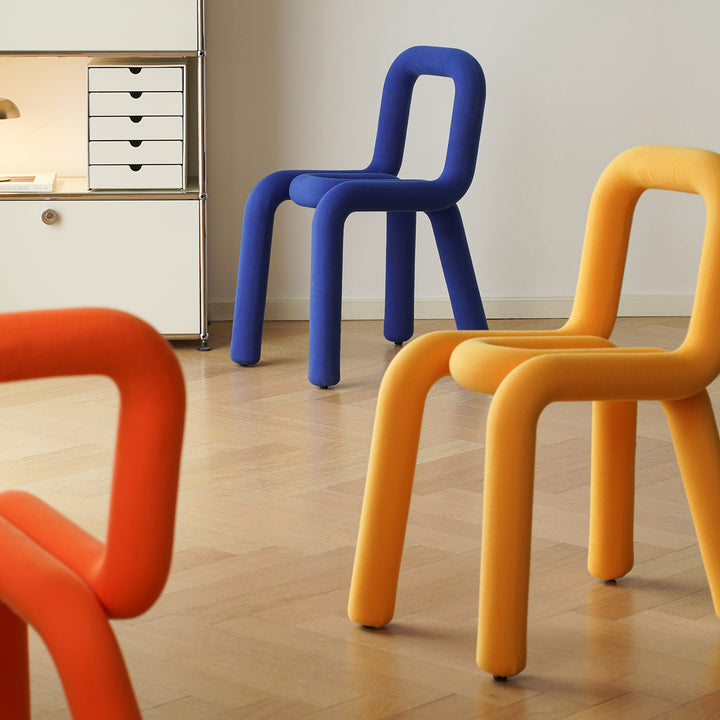 Contemporary velvet fabric dining chair bold in details.