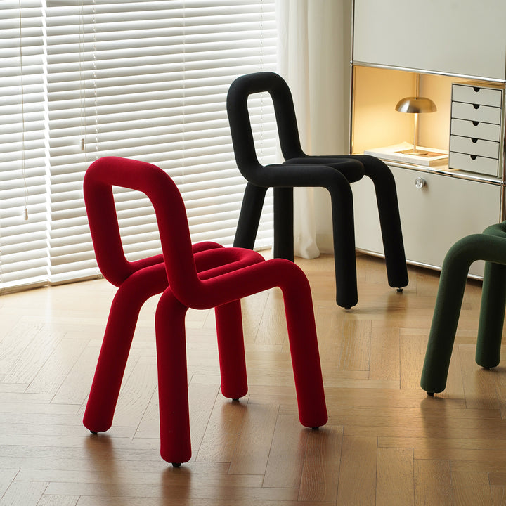 Contemporary velvet fabric dining chair bold in close up details.