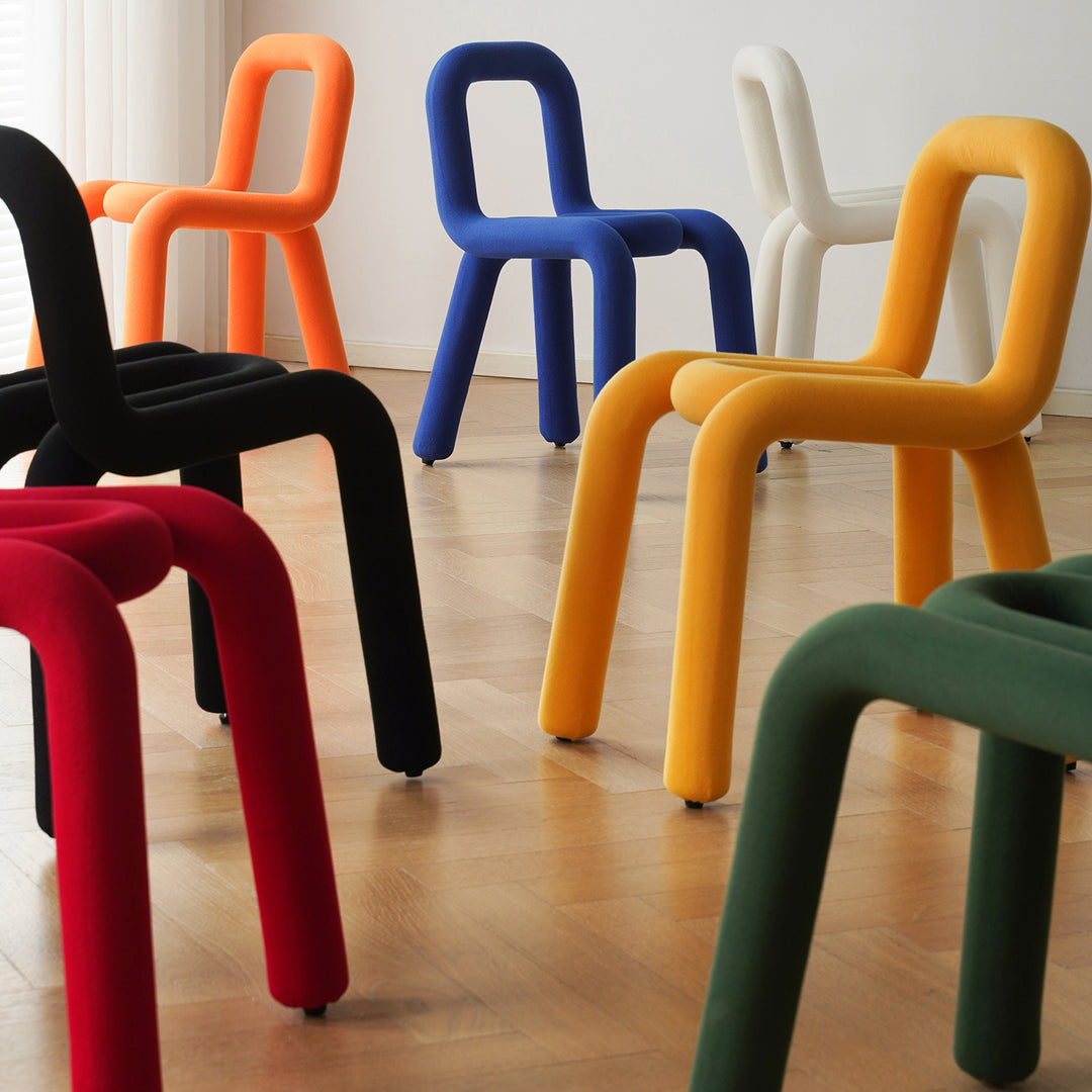 Contemporary velvet fabric dining chair bold conceptual design.