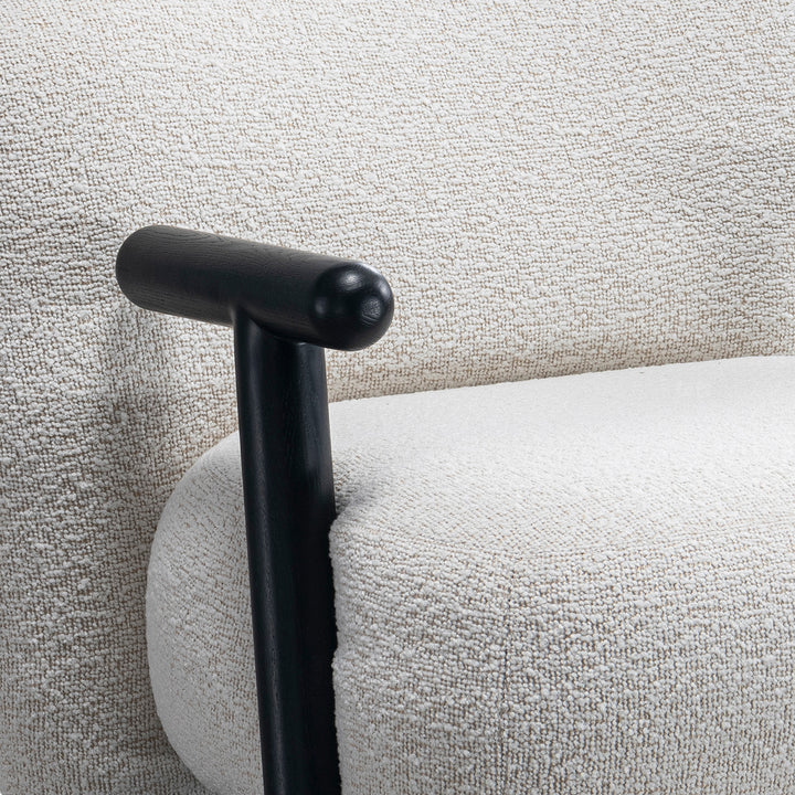 Cream boucle fabric 1 seater sofa with armrest malt with context.