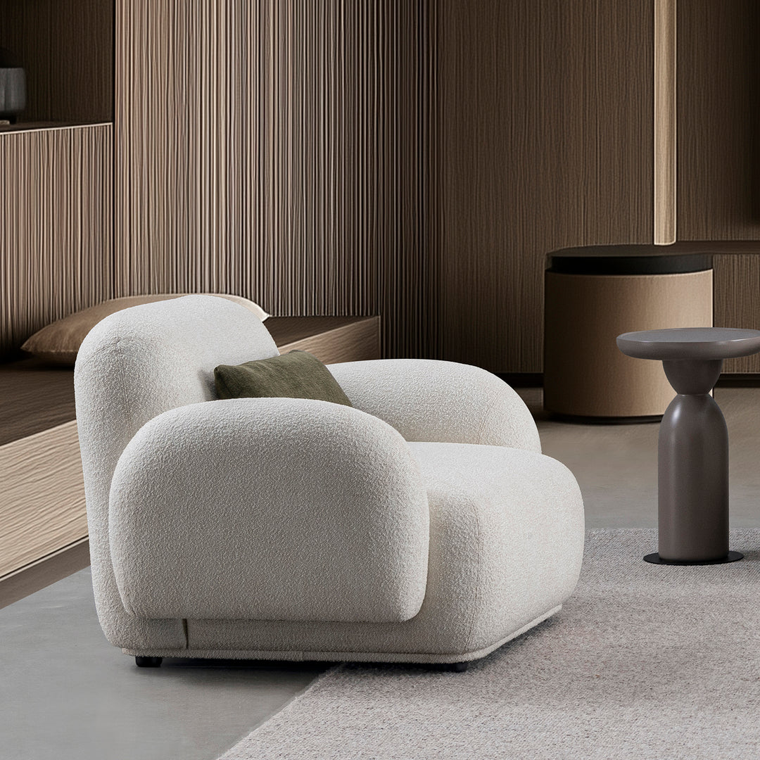 Cream boucle fabric 1 seater sofa pluum primary product view.