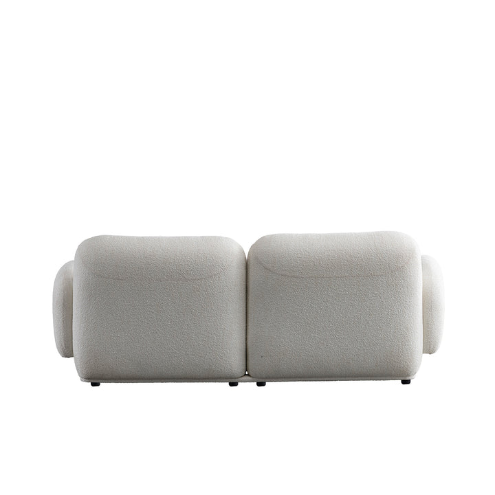 Cream boucle fabric 2 seater sofa pluum with context.