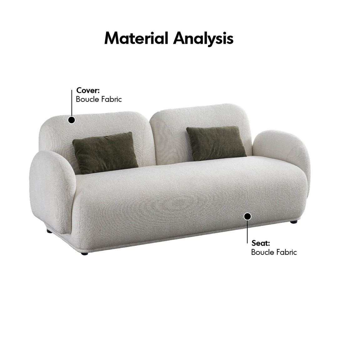 Cream boucle fabric 2 seater sofa pluum in details.