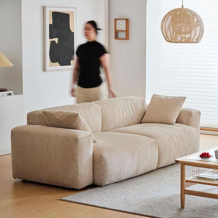 Cream corduroy velvet fabric 2 seater sofa square in details.