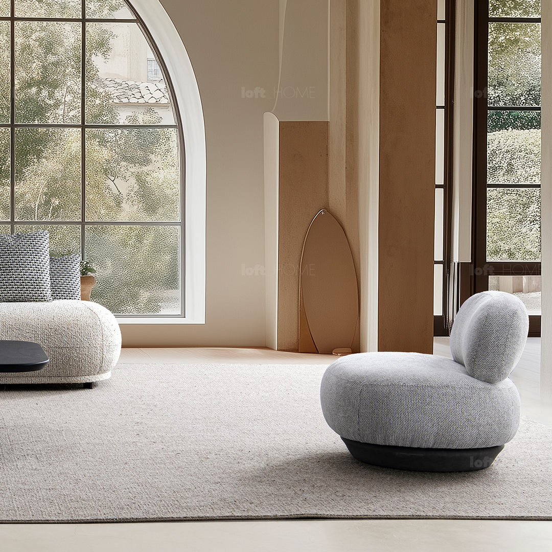 Cream mixed weave fabric revolving 1 seater sofa bixy in real life style.