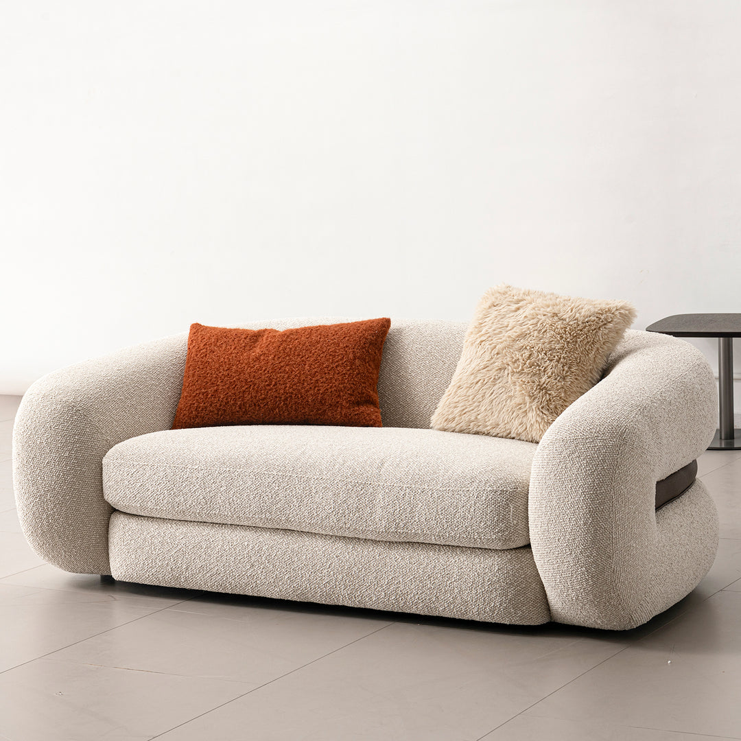 Cream boucle fabric 2 seater sofa curly in panoramic view.