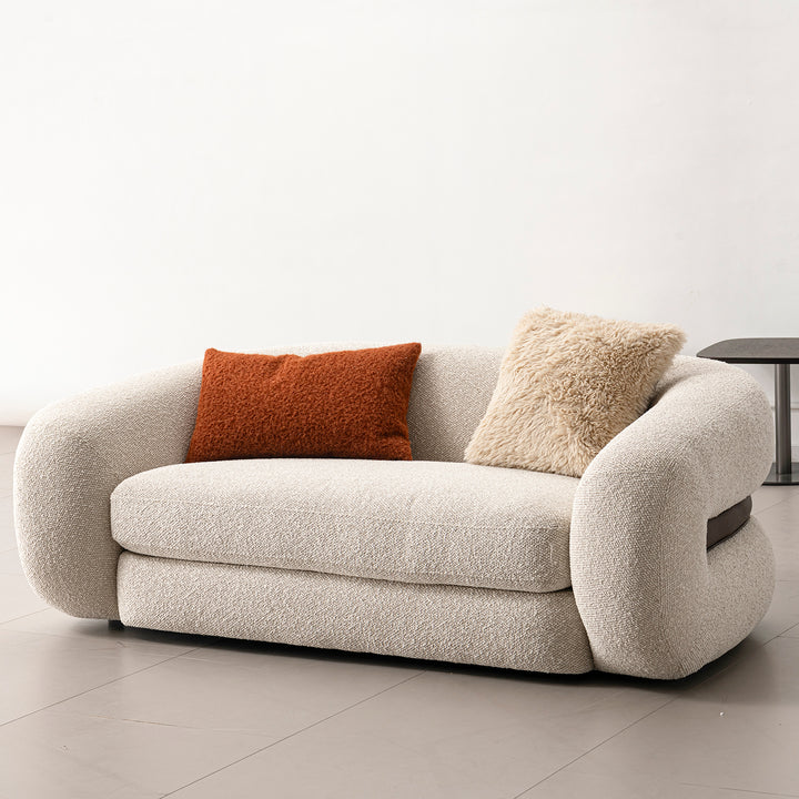 Cream boucle fabric 2 seater sofa curly in panoramic view.