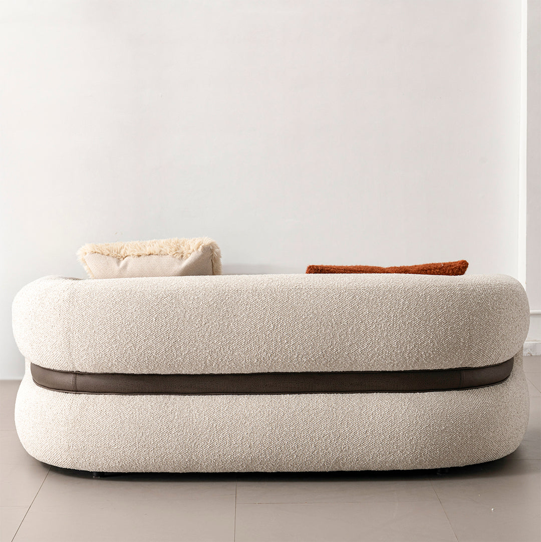 Cream boucle fabric 2 seater sofa curly in still life.