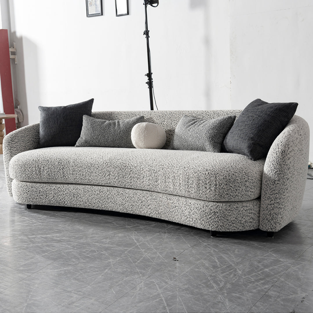 Cream boucle fabric 4 seater sofa nova in panoramic view.