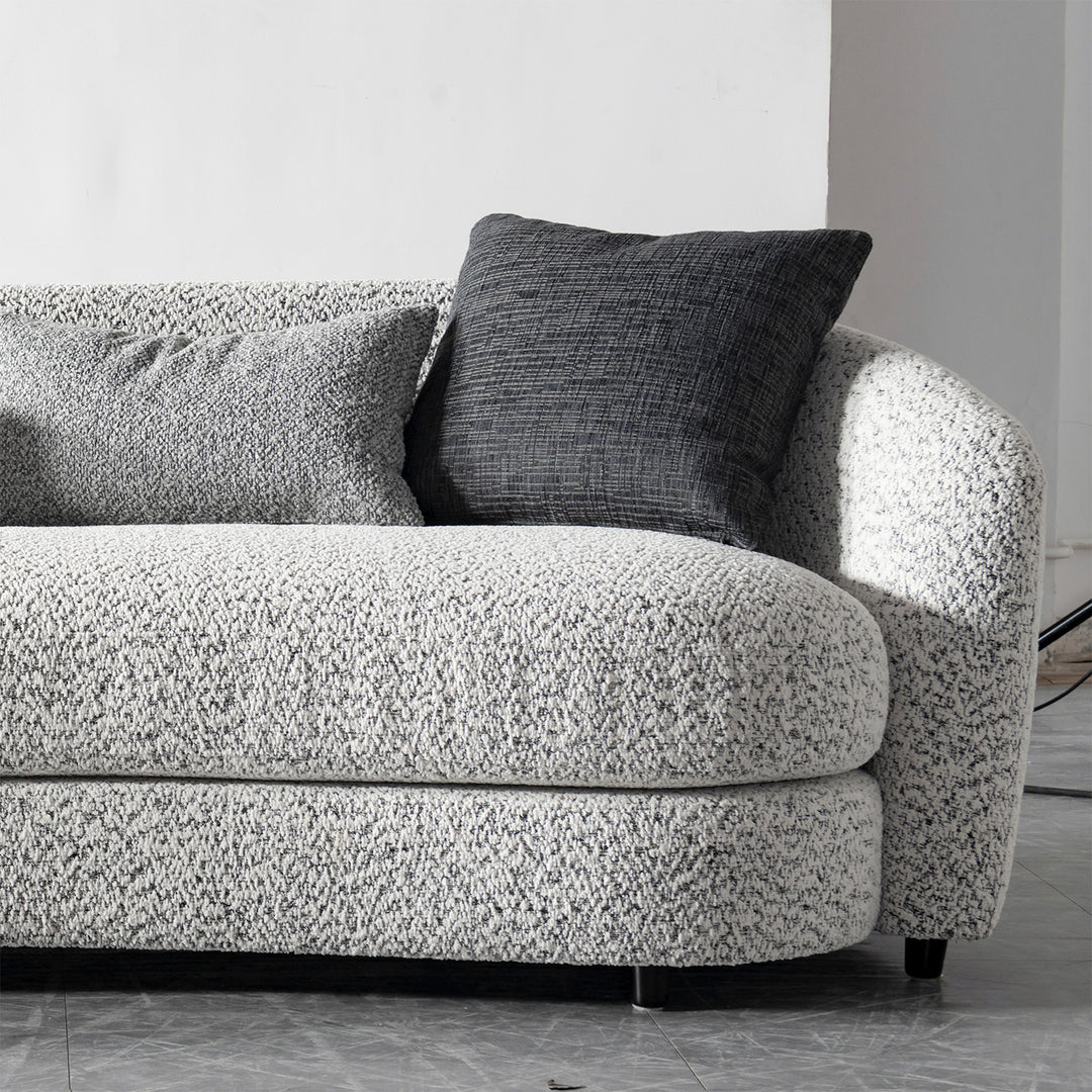 Cream boucle fabric 4 seater sofa nova in still life.