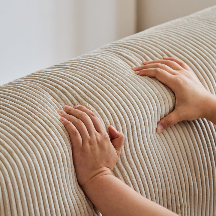 Cream corduroy velvet fabric 3 seater sofa square in close up details.