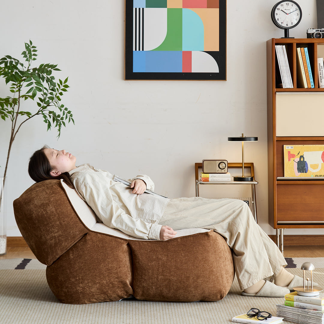 Cream velvet fabric 1 seater sofa lazy with context.