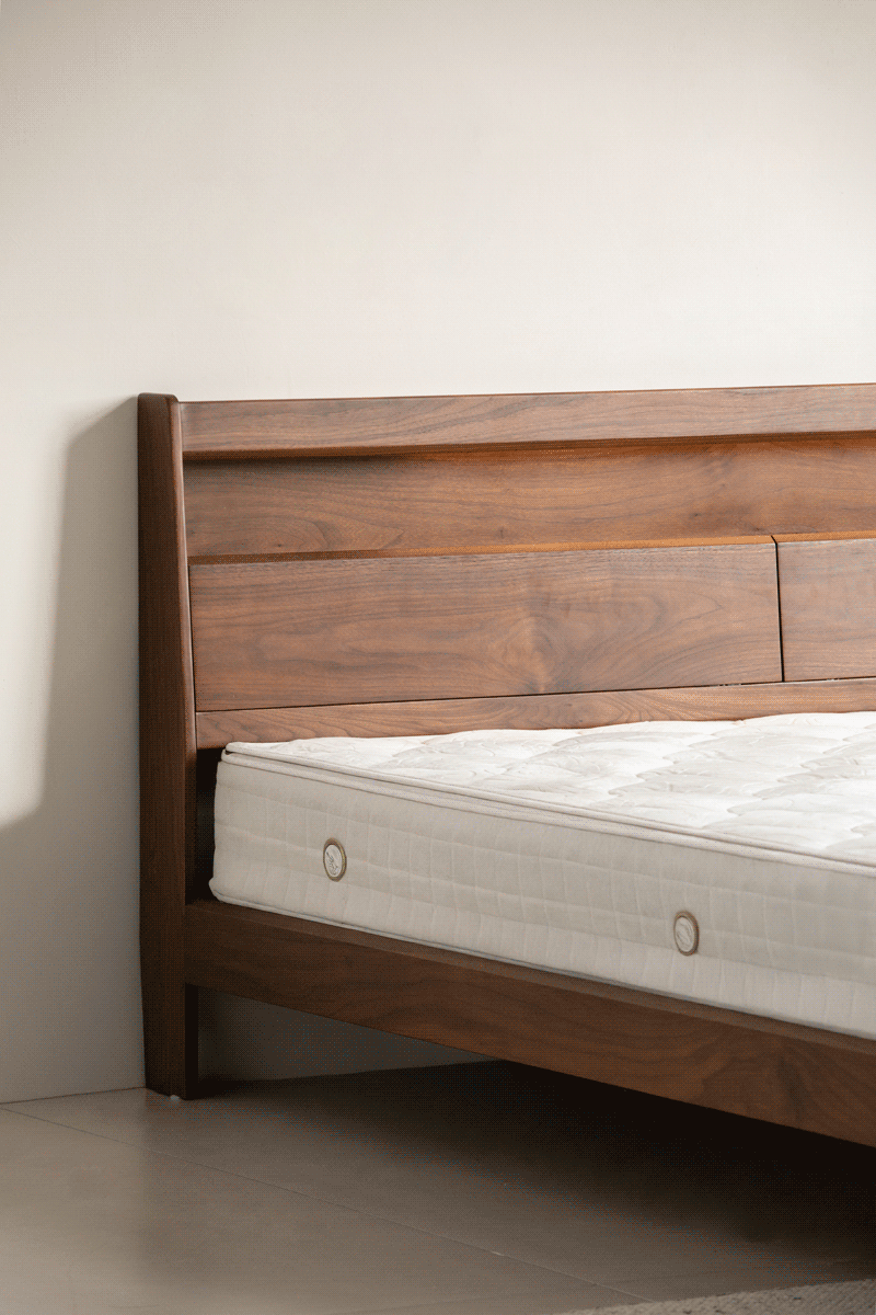 Vintage walnut wood bed accompany light layered structure.