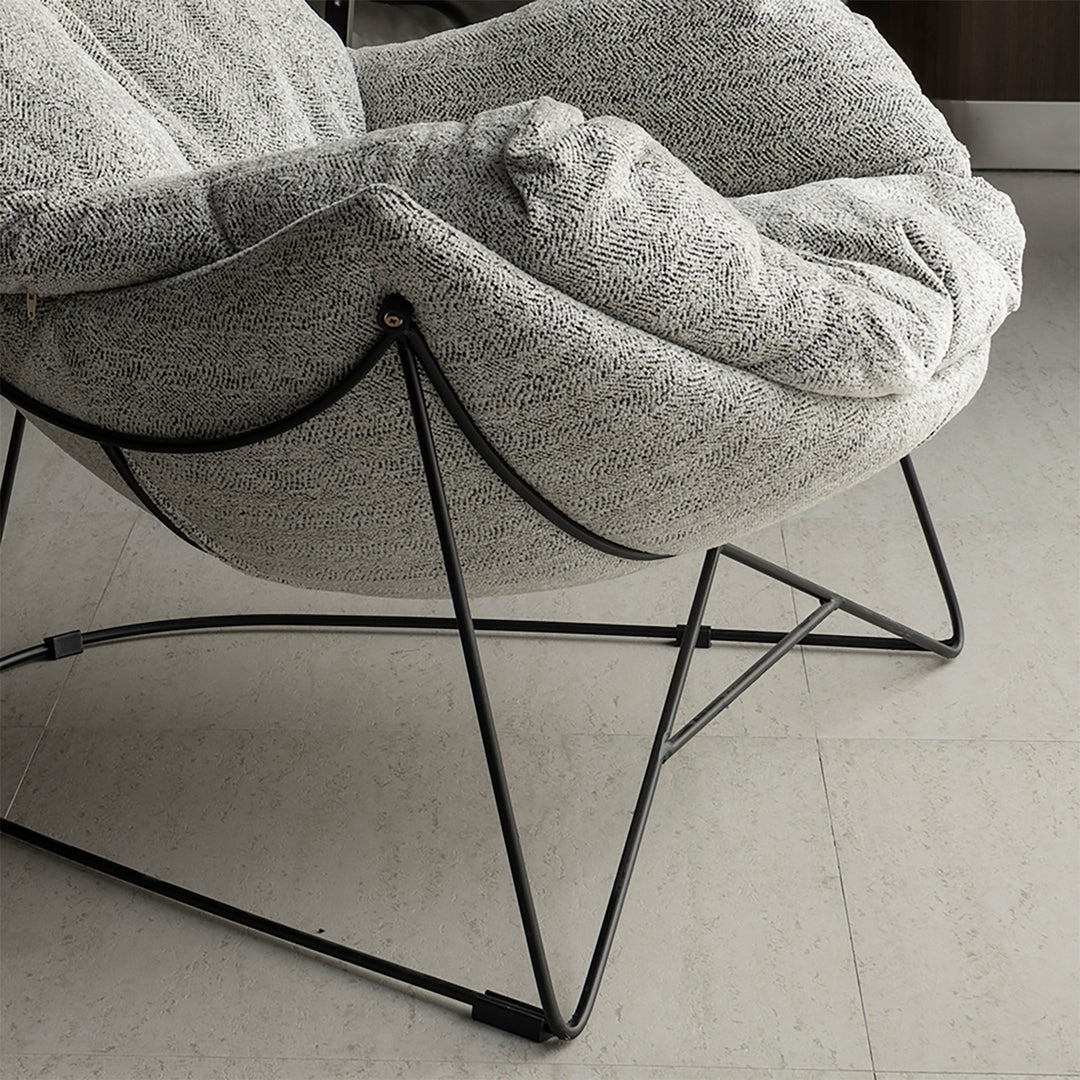 Industrial mixed weave fabric 1 seater sofa chair pomp in close up details.