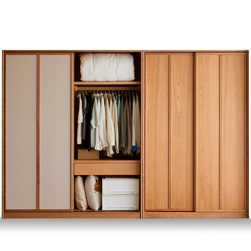Wooden wardrobe with clothes and storage compartments on a white background