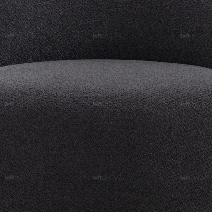 Cream mixed weave fabric revolving 1 seater sofa apse in panoramic view.