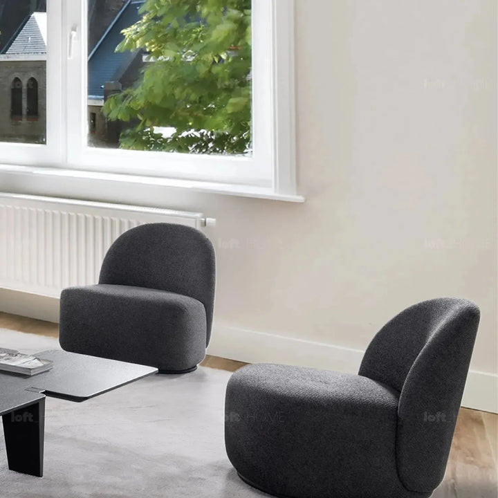 Cream mixed weave fabric revolving 1 seater sofa apse in close up details.